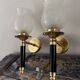 Pair of brass and black torchiere wall lights