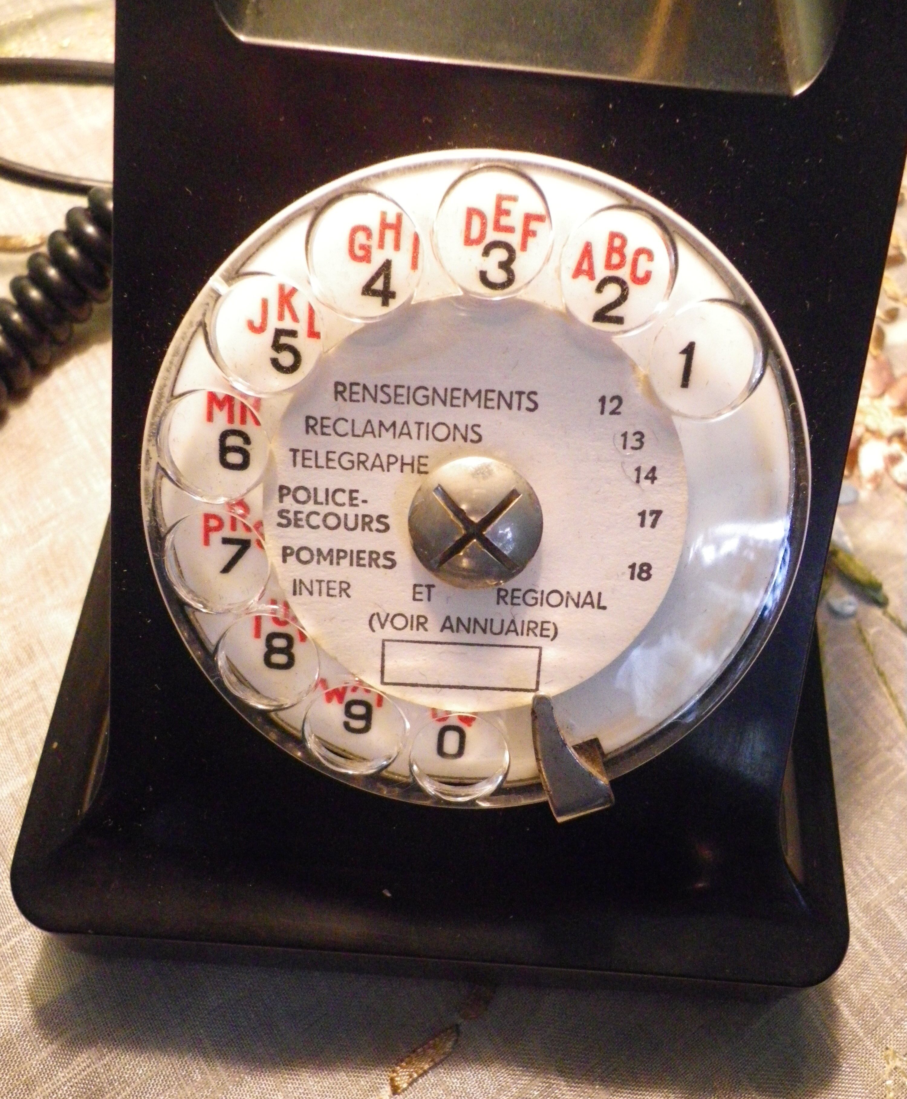 Black bakelite phone with earphone