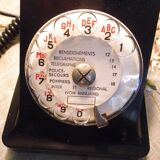 Black bakelite phone with earphone