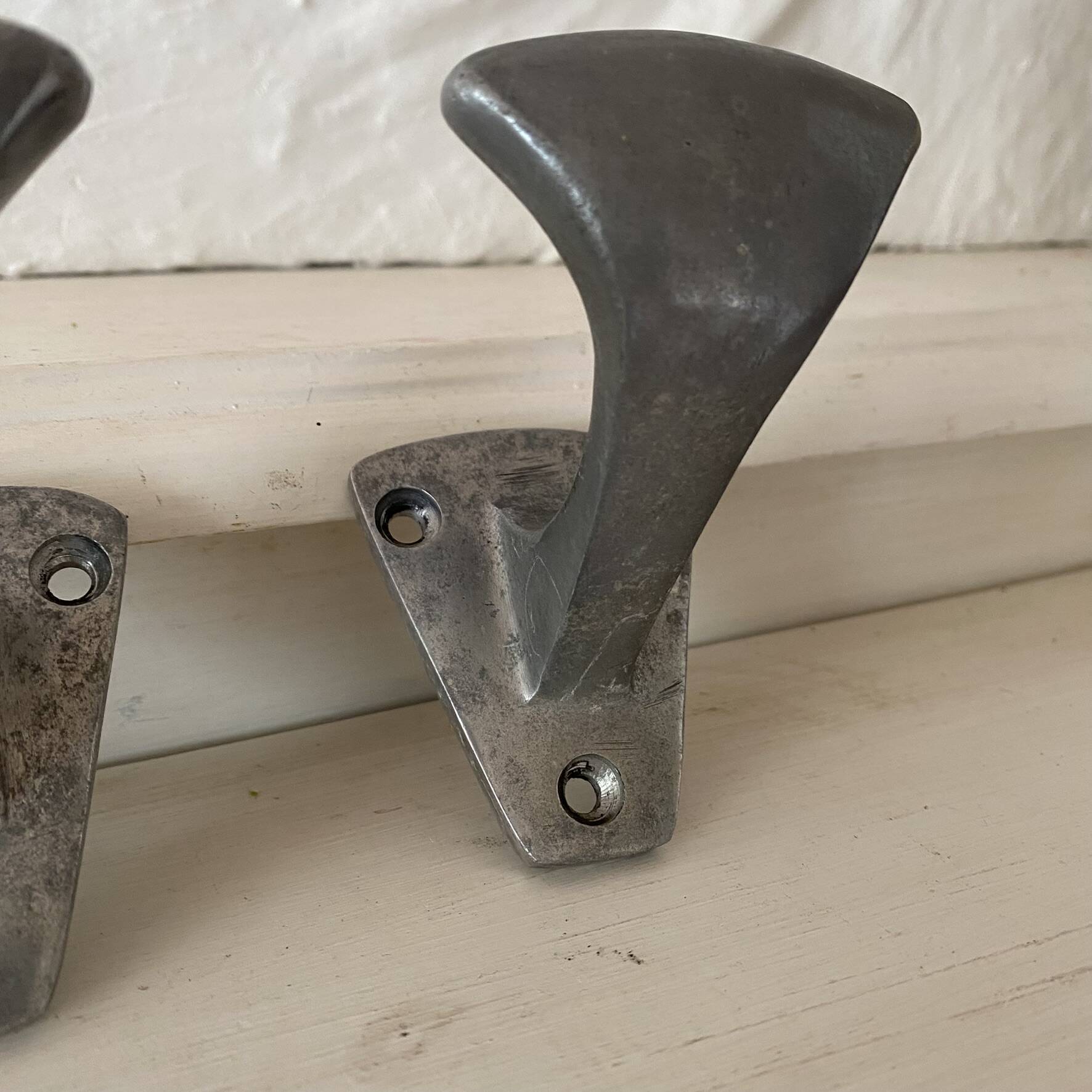 Set of 3 vintage steel hooks from a school.