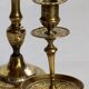 Duo of solid brass and gold metal candle holders worked old