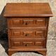 Vintage bedside cabinet with three drawers in moulded wood, Louis XV style.