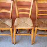 Set of 5 mismatched straw chairs.