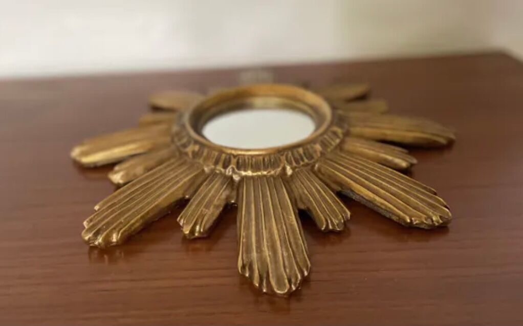 Vintage sun mirror in golden resin 60s/70s