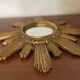 Vintage sun mirror in golden resin 60s/70s