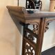 Chinese console in ancient elm, carved openwork legs and top g