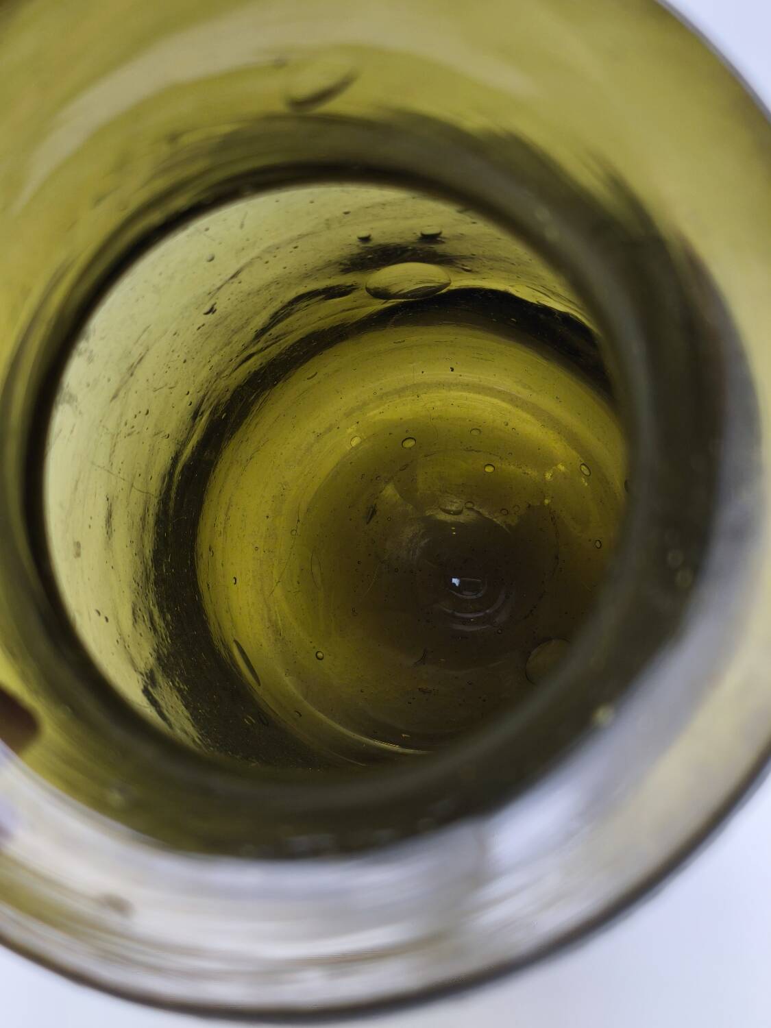 Old olive green blown glass mushroom jar, decorative object.