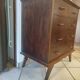 Vintage chest of drawers from the 1950s with wooden legs and a design feature.