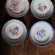 A set of 4 flat plates in pink and blue with Fontanges flowers from Sarreguemines.