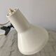Off-white articulated architect lamp.