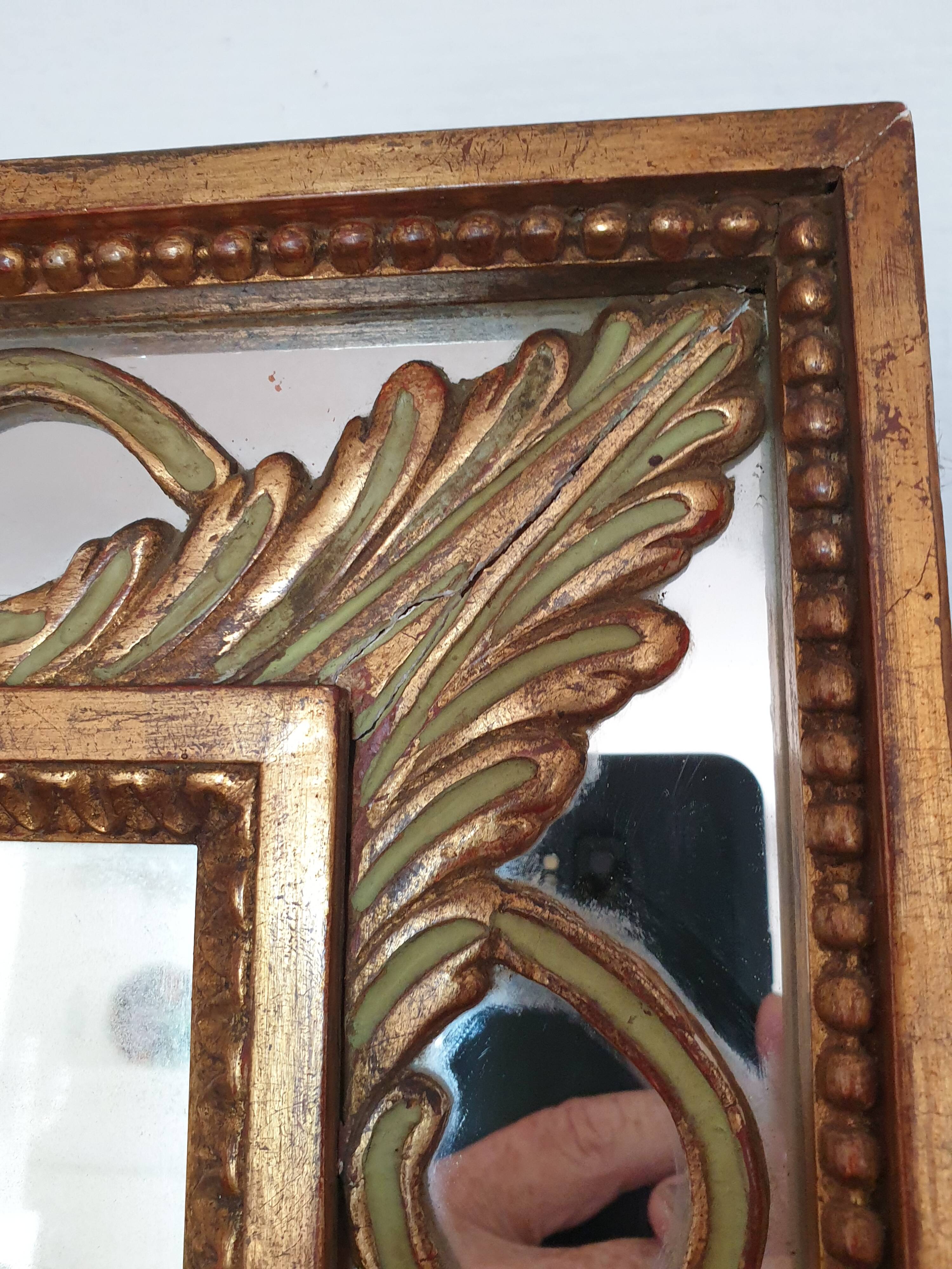 Classic antique mirror in gilded wood