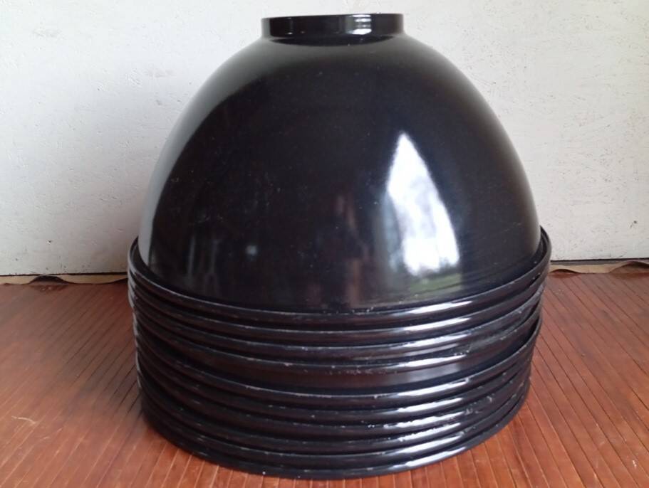 Set of 10 large industrial enamelled metal pendants.
