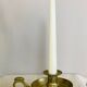 20th century chiseled brass socket candle holder representing Horsemen in armor