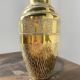 Duo of embossed brass vases