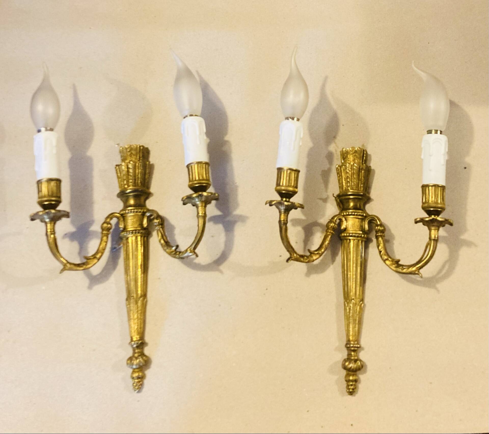 Louis XVI bronze wall sconces from the 19th century with quiver decorations.