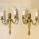 Louis XVI bronze wall sconces from the 19th century with quiver decorations.