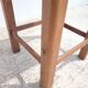 Tabouret ancien en bois foncé patiné