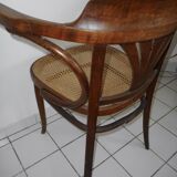 Wooden armchair with caned base