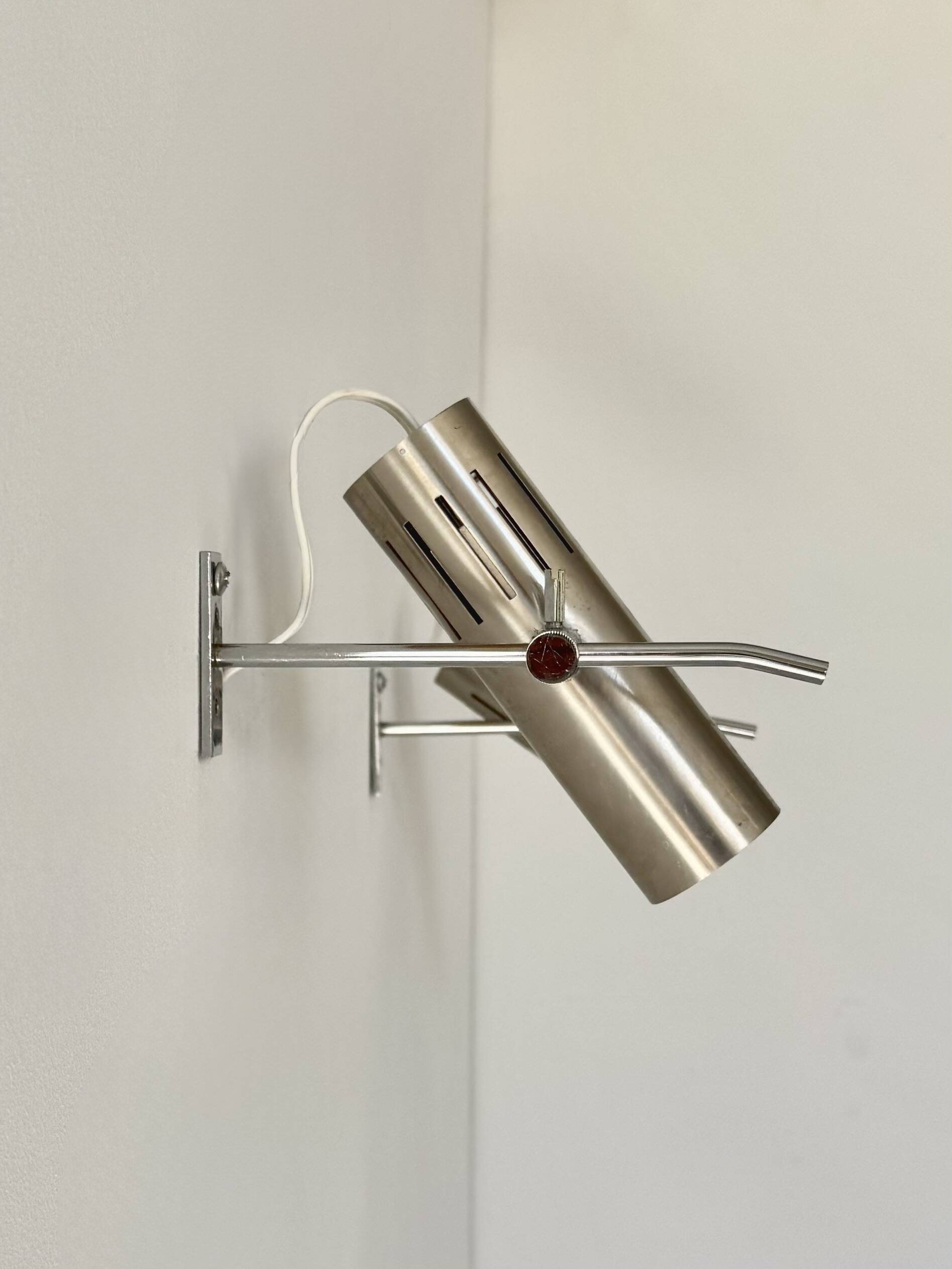 Pair of vintage wall sconces by Alain Richard, metal and aluminium, France.