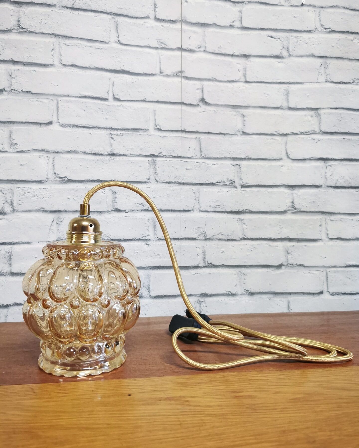 Old vintage hanging lamp stroller in moulded glass