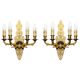 Pair of L'Originale wall sconces plated with 24-carat gold featuring four bronze candles.