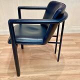 Set of 3 designer leather and metal armchairs.