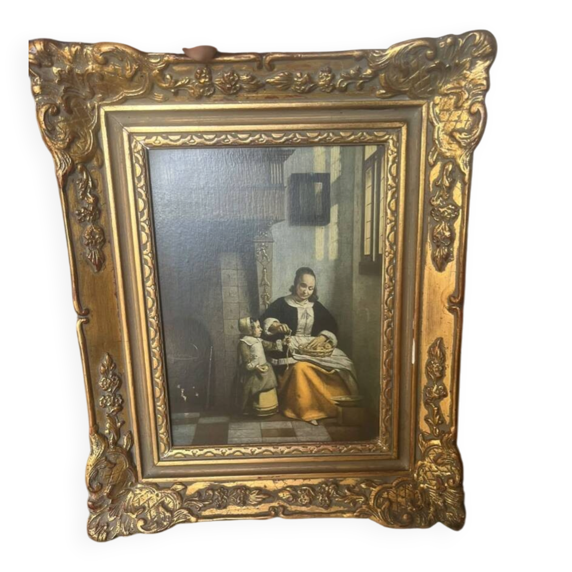 Framed reproduction painting with a golden frame.