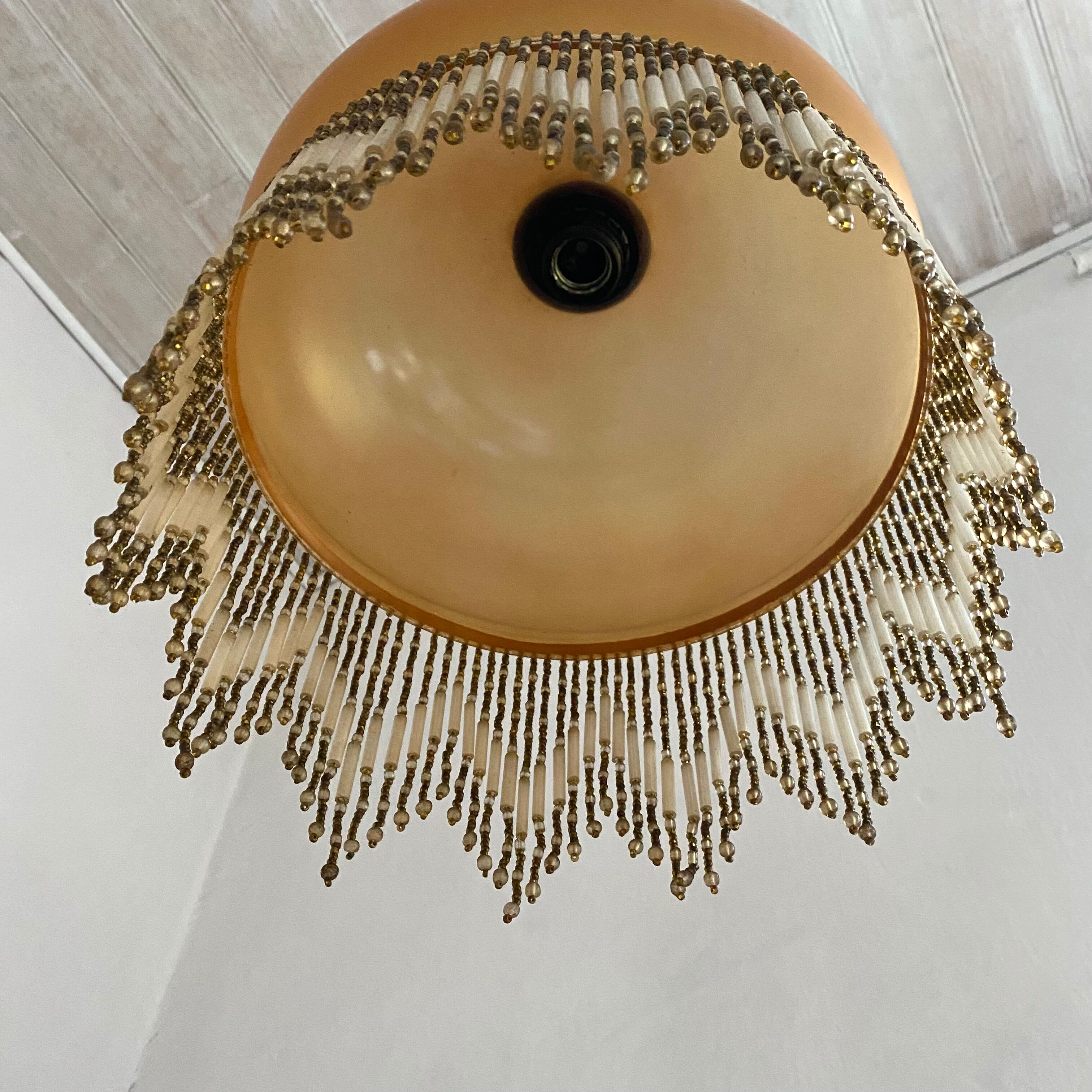 Amber polished glass and pearl suspension