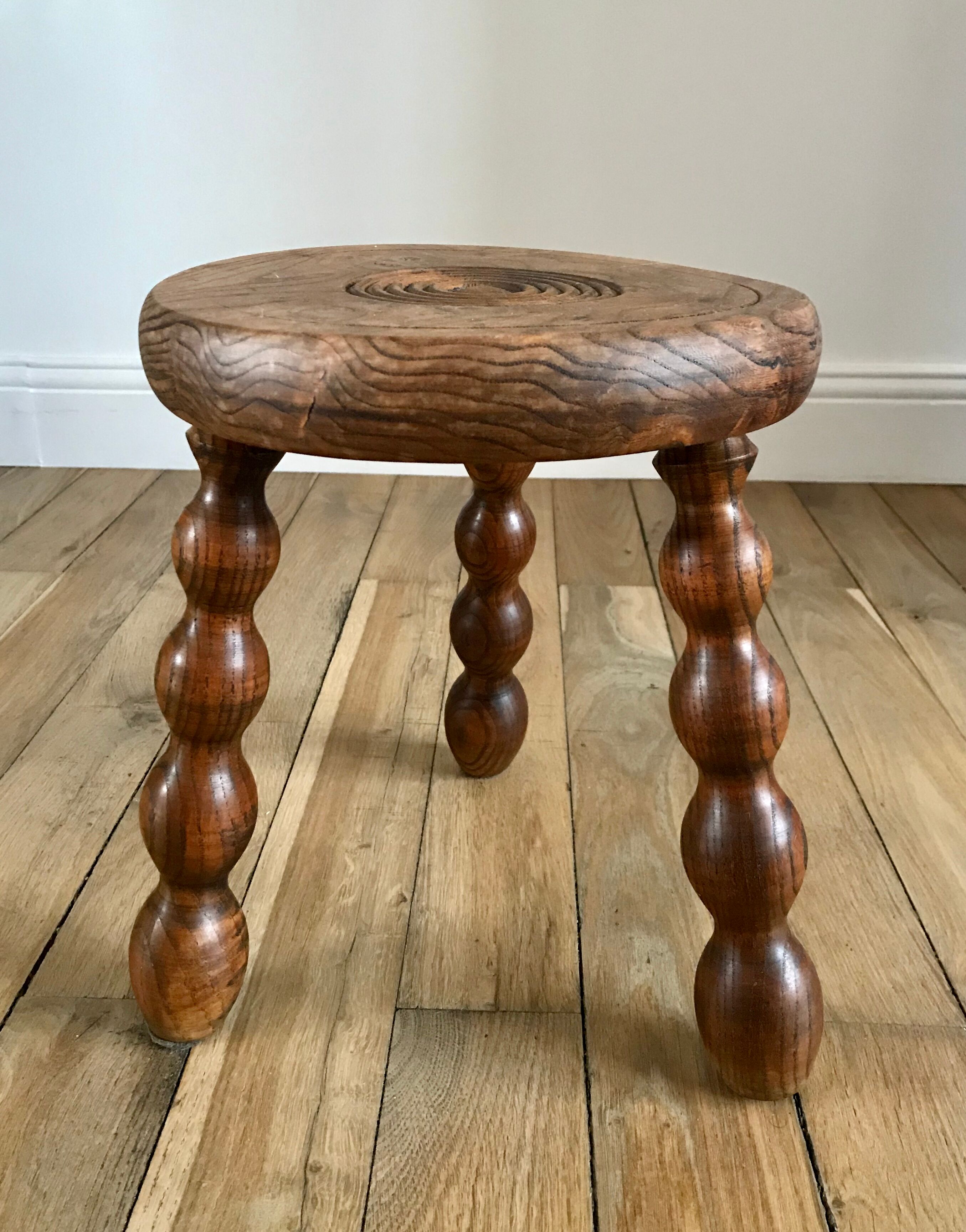 Low wooden stool turned solid 70s