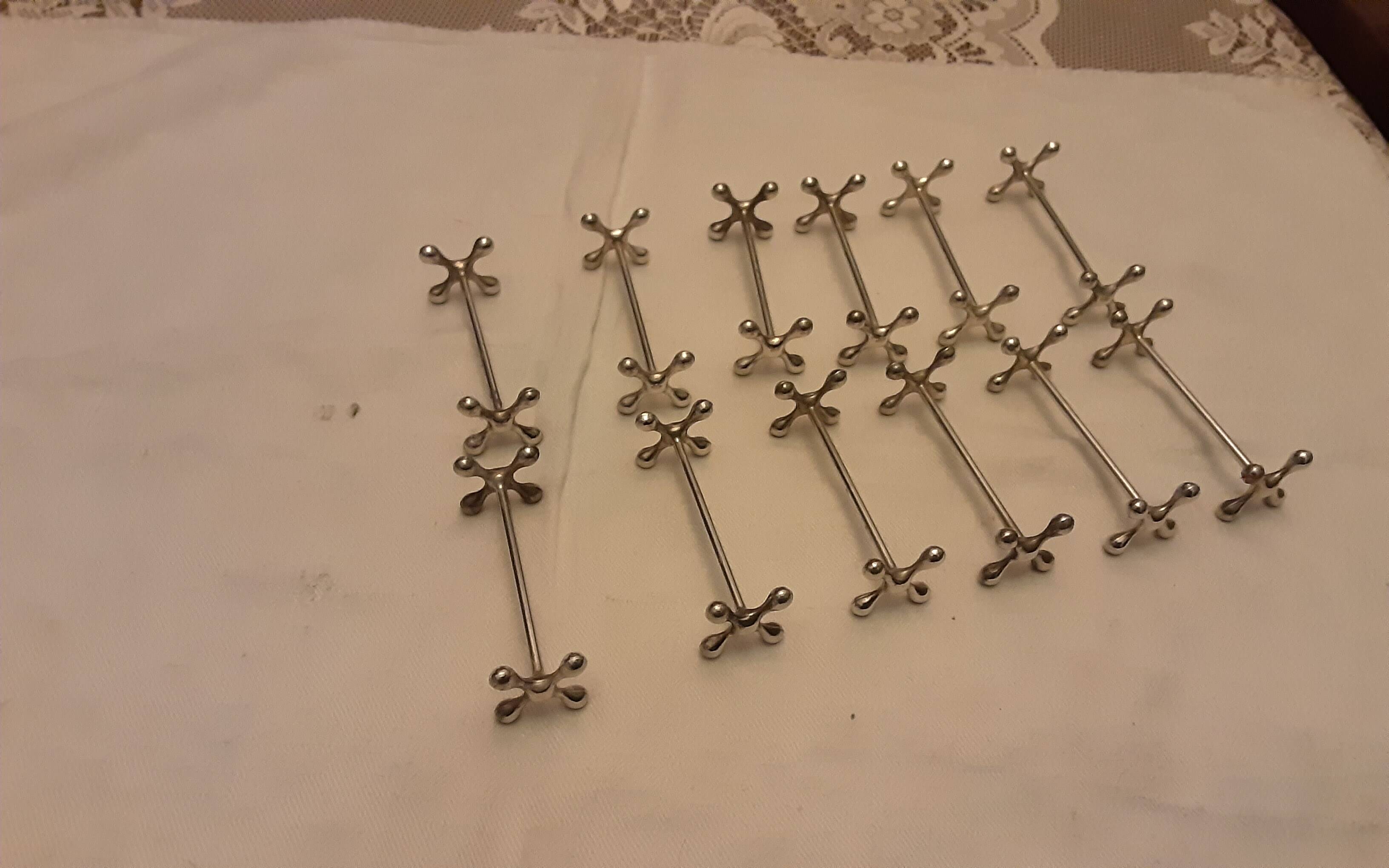 12 silver metal knife holders punched