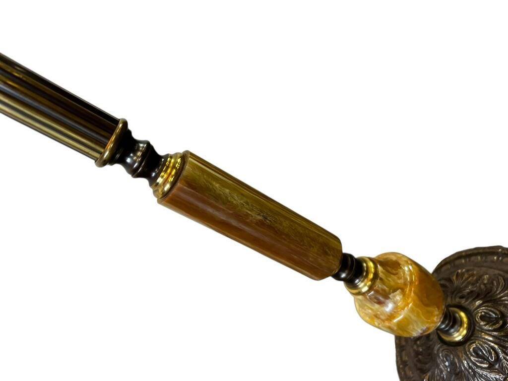 Vintage gold floor lamp with fringed shade.