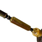 Vintage gold floor lamp with fringed shade.