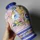 Vintage Portuguese vase in glazed terracotta with hand-painted floral decoration.