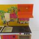Kitchen doll, child in tole 70s