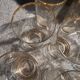 9 art-deco glasses in engraved crystal with gold trim