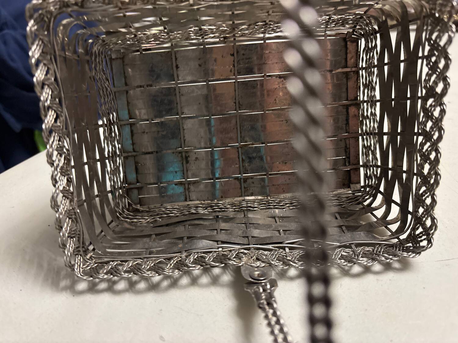 Antique woven metal basket