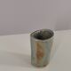 Signed vase in enamelled sandstone with stylized face