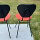 2 ant chairs in black and red skaï feet in black metal