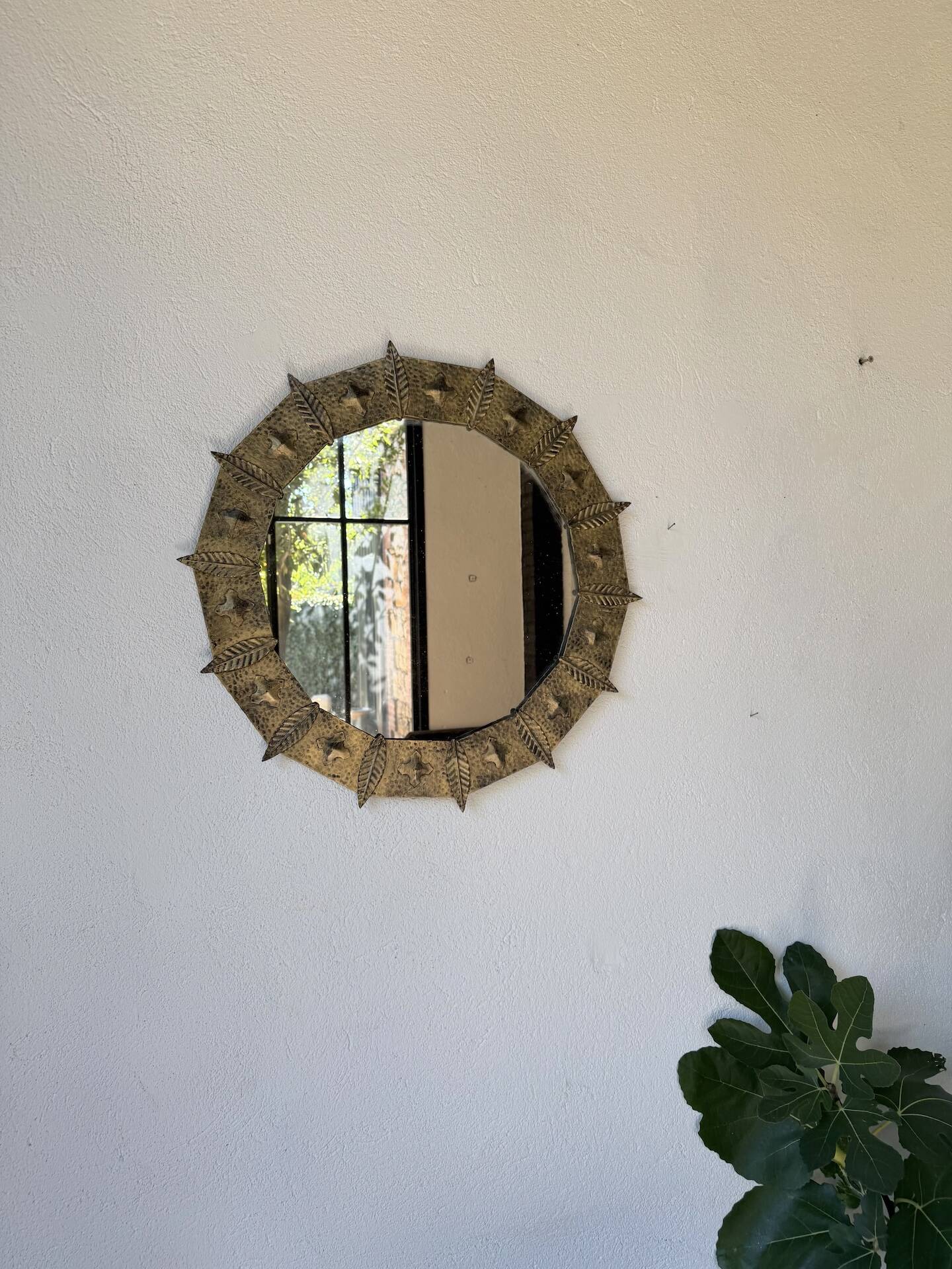 Brutalist round hammered gold metal mirror