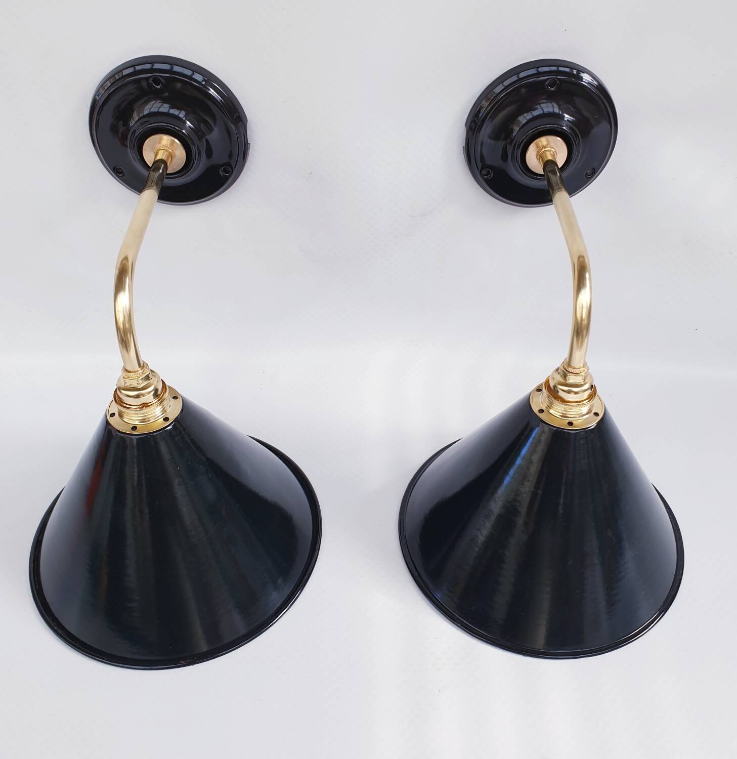 Pair of antique black enamelled sheet metal wall lights