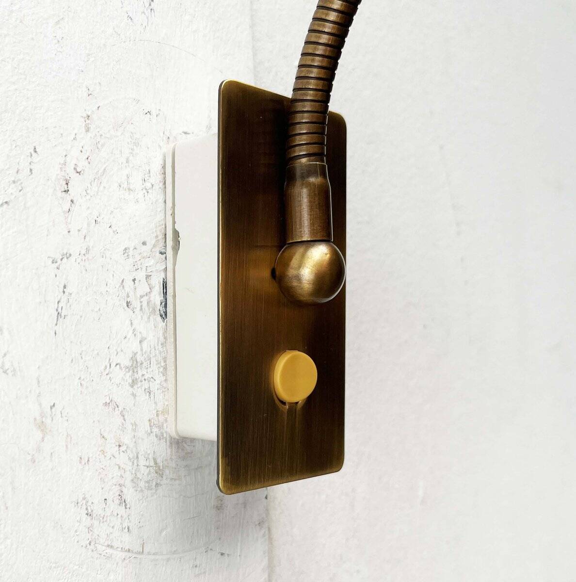 Vintage German brass patinated wall lamp with a gooseneck design by Honsel, 1970s.