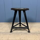 Unmarked black Rowac stool with a dark wood seat.