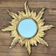 Miroir soleil en bois doré