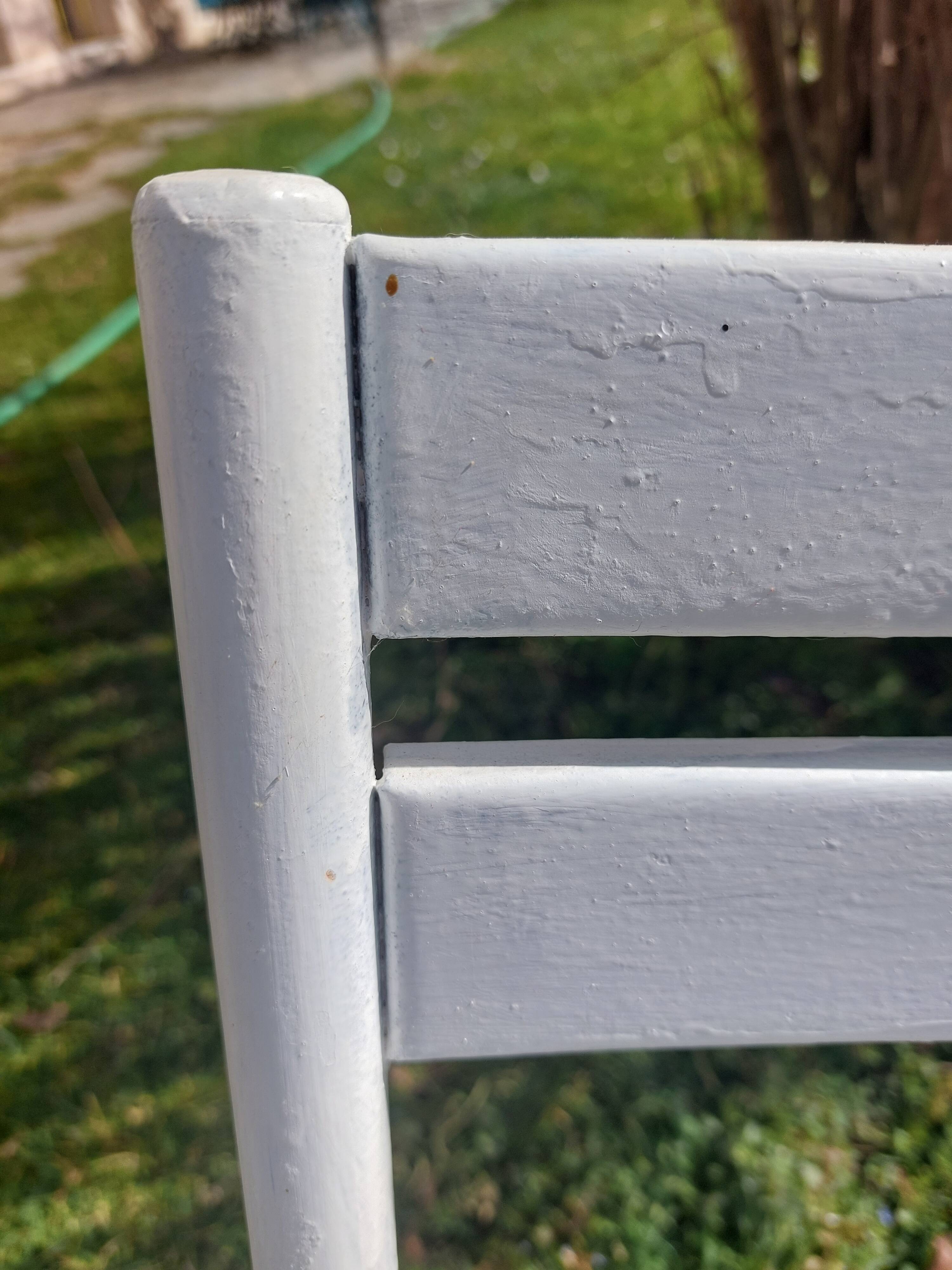 pair of white metal chairs, Tolix style