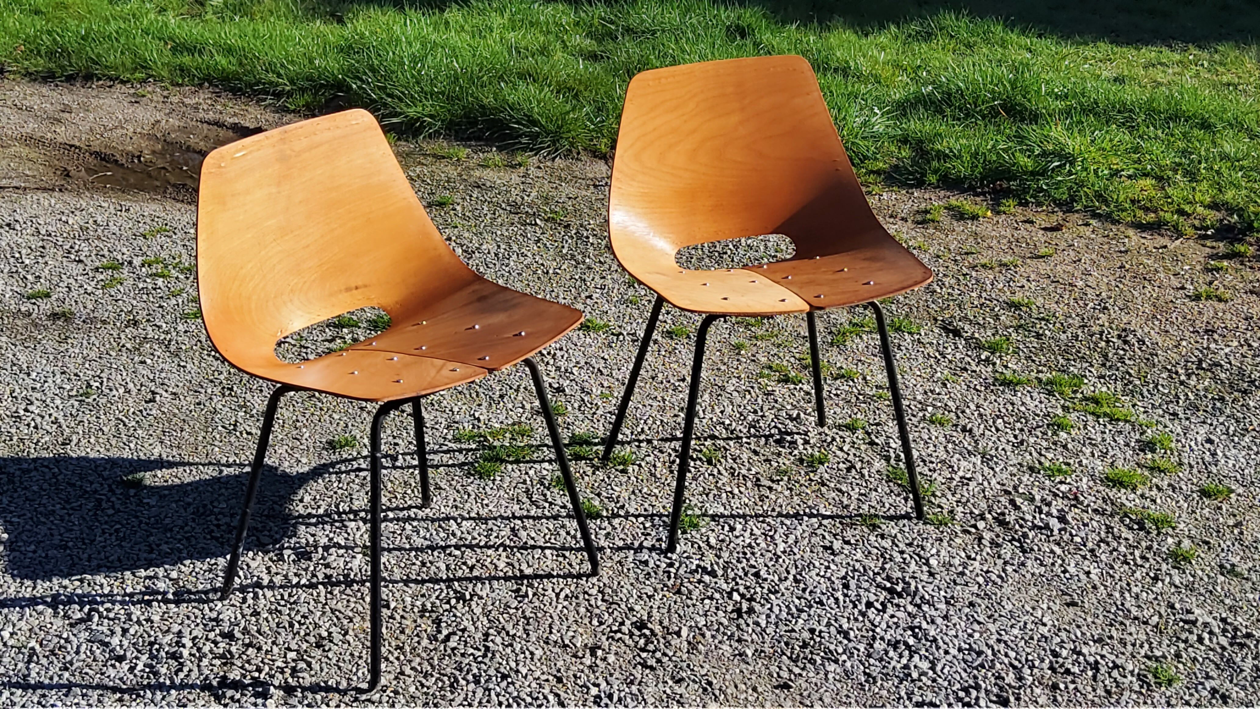 Pair of tonneau chairs by Pierre Guariche plywood base tubes 1954