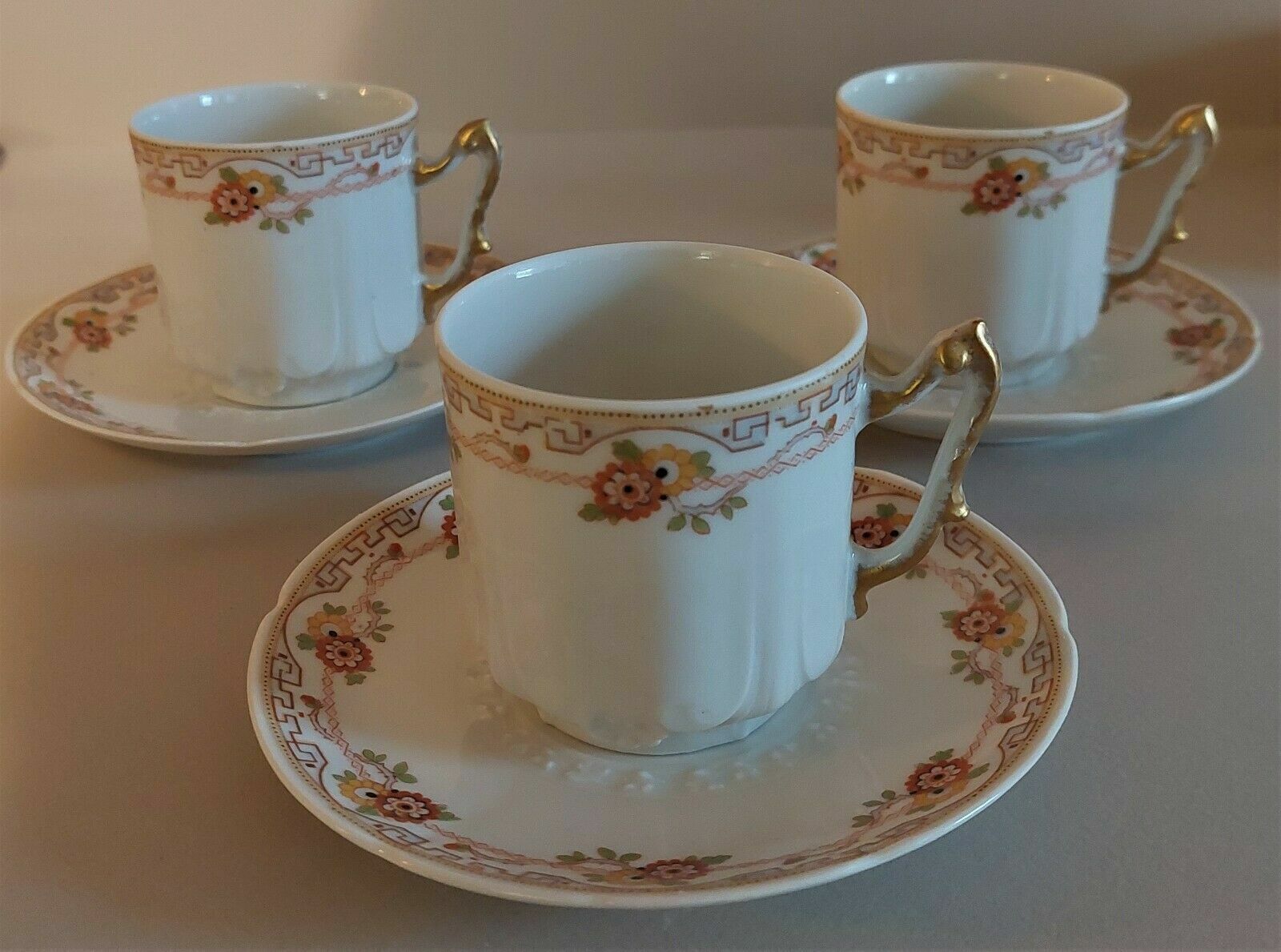 Porcelain cups UC Limoges, series of three