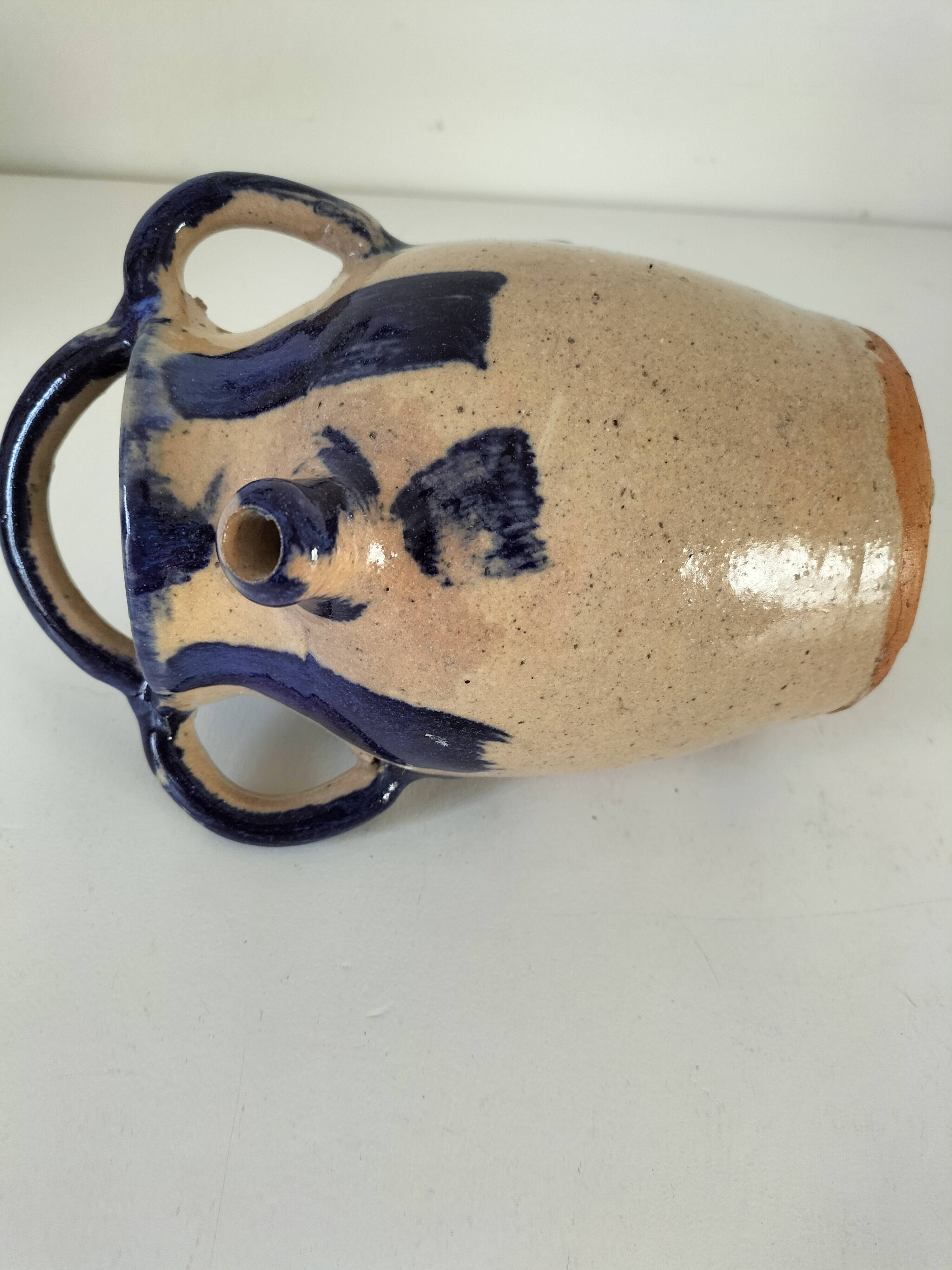 Old pitcher (goat) in cobalt glazed earthenware