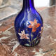 Legras vase en verre bleu marine émaillé à décor de fleurs de lys