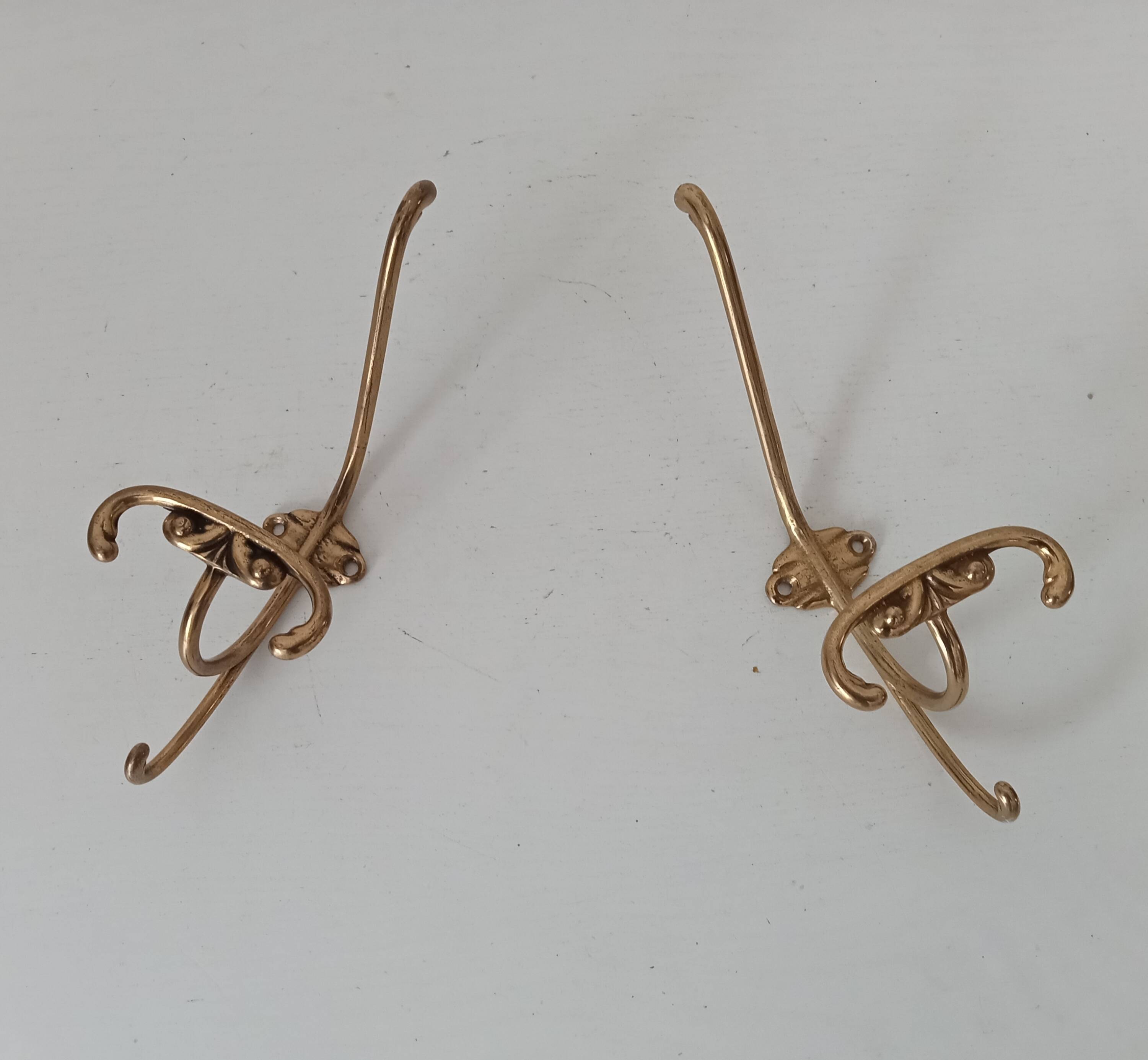 Old coat hook in solid golden brass