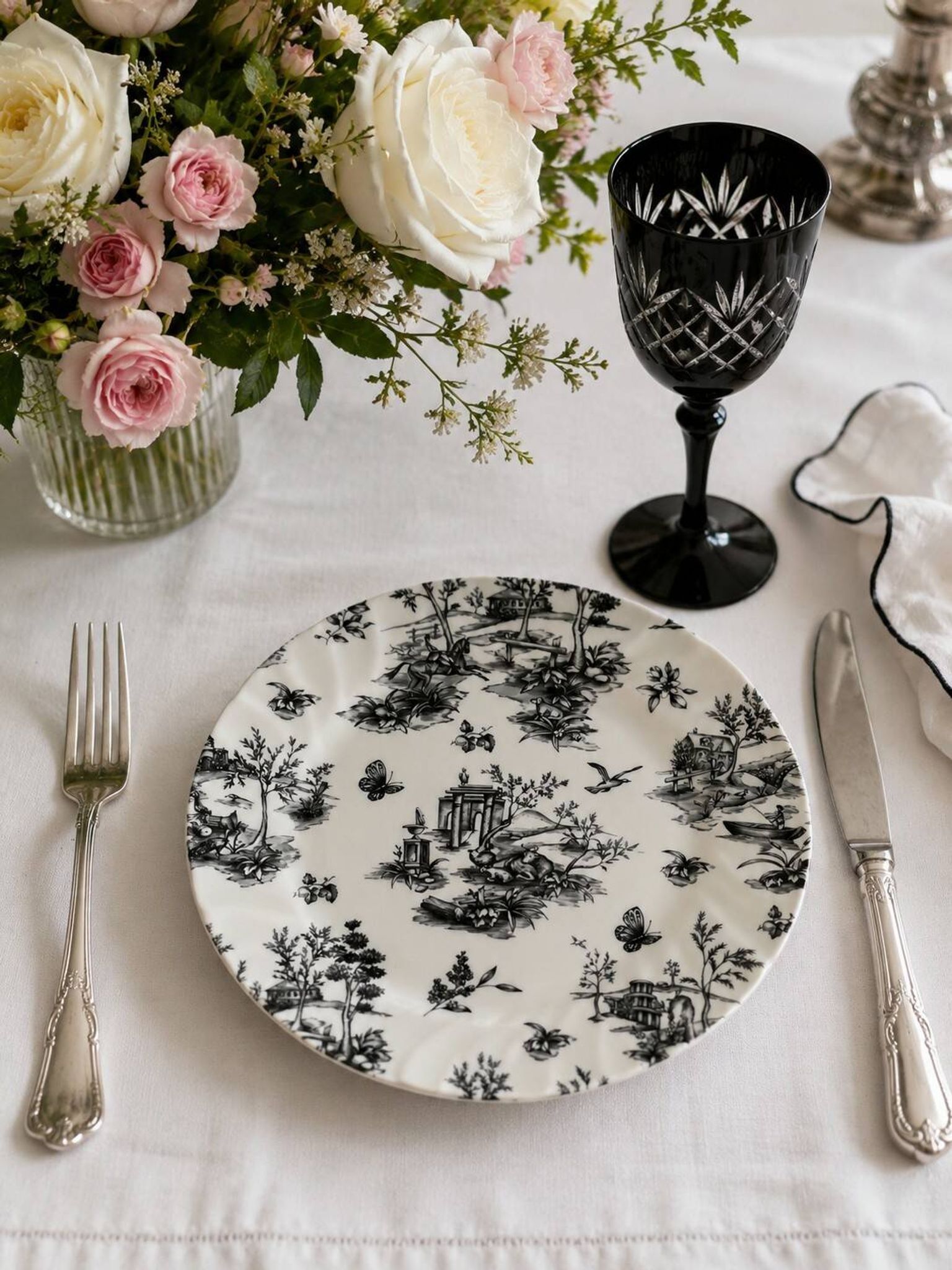 Set of black and white plates in the style of toile de Jouy.